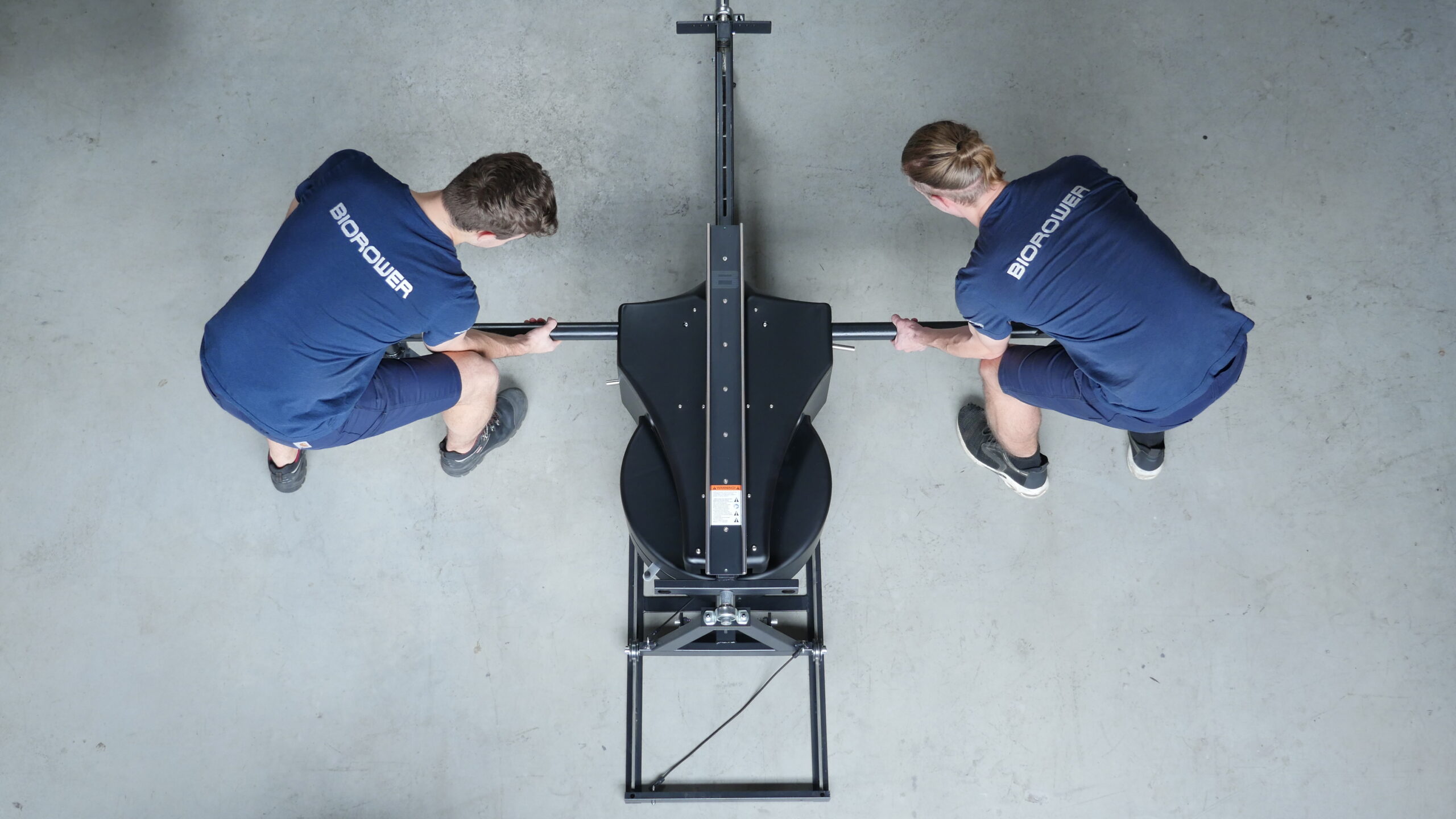 Two mechanics assemble a BIOROWER Pro, which is considered to be the worlds best indoor rower.